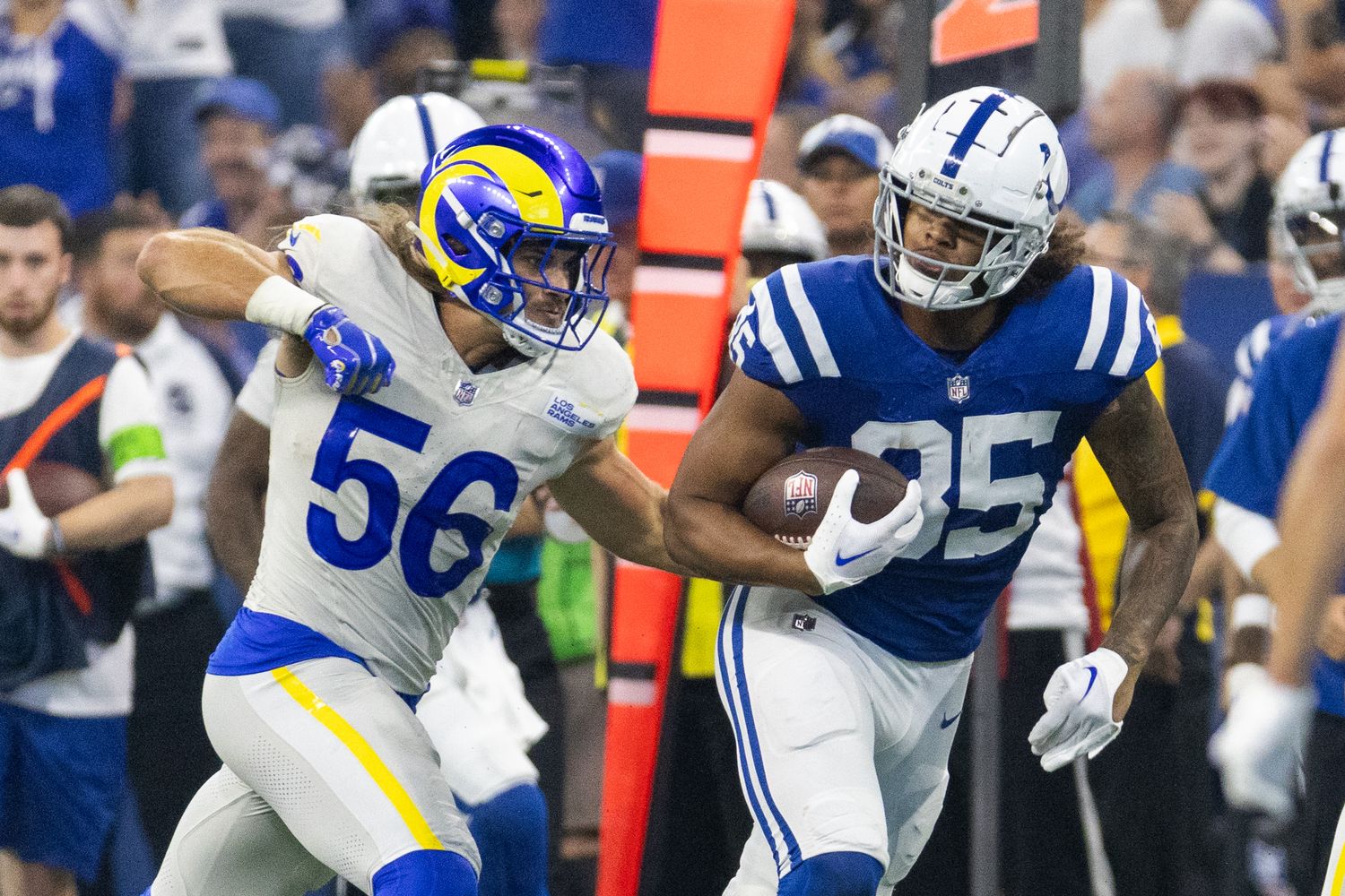 Oct 1, 2023; Indianapolis, Indiana, USA; Indianapolis Colts tight end Drew Ogletree (85) runs with the ball while Los Angeles Rams linebacker Christian Rozeboom (56) defends in the second half at Lucas Oil Stadium. Mandatory Credit: Trevor Ruszkowski-USA TODAY Sports
